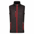The RG341 by Regatta Professional is a black quilted sleeveless vest with a high collar, featuring red zippers on the front and pockets.