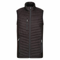 RG341 by Regatta Professional is a black puffer vest featuring a high collar and three zippered pockets on the front.