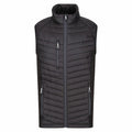 The RG341 by Regatta Professional is a black padded vest featuring a high collar, zipper closure, and two side zippered pockets. Its diagonal stitching provides texture on the front, and it boasts a lightweight and sleeveless design.
