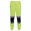 RG459 pants from Regatta High Visibility, featuring a vibrant neon yellow color with reflective strips over the knees and elasticized ankles.