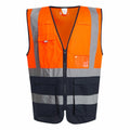 Regatta High Visibility's RG469 vest features a vibrant orange color with gray reflective stripes and multiple pockets.