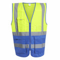 The Regatta High Visibility RG469 vest is a sleeveless, high-visibility safety garment with a bright yellow top and blue bottom. It features reflective silver stripes, multiple pockets, and a convenient front zipper.