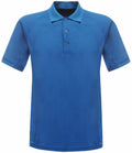 The product RG524 from Regatta Standout is a plain blue polo shirt with short sleeves and a collar that includes a three-button placket. The fabric of the shirt is smooth with a subtle sheen.