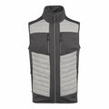 The RG542 by Regatta Professional is a padded vest in black and gray, designed with a high collar, front zipper, and two vertical zippered pockets.
