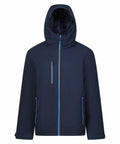 The RG580 by Regatta Professional is a dark blue hooded jacket equipped with a front zipper and three zipped pockets, featuring light blue accents on the zippers. Its simple and functional design makes it suitable for outdoor activities.