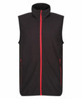 Regatta Professional's RG583 is a black sleeveless vest featuring a red zipper and red zippered pockets, showcased against a white background.