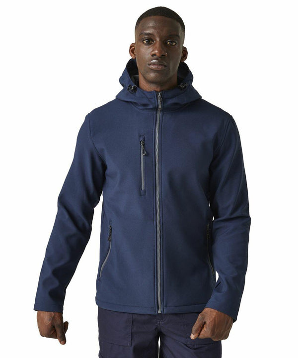 A person is wearing a navy blue Regatta RG594 hooded jacket with zippered pockets, standing against a plain white background.