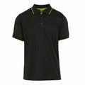The RG596 by Regatta Professional is a black polo shirt with a collar, three buttons, and features subtle green trim on the sleeves and collar edge.