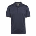 The RG596 from Regatta Professional is showcased on a white background, featuring a dark navy blue design with short sleeves and a three-button placket. The fabric exhibits a smooth and slightly shiny finish, lending the shirt a classic and versatile appeal.