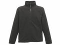 The Regatta Classics RG601 is a dark green fleece jacket showcased against a simple white backdrop. It includes a full-length front zipper, long sleeves, and a high collar to enhance warmth. For practicality, it is equipped with side pockets.