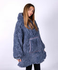 Person wearing a large, blue, furry Ribbon RI001 poses against a plain background.