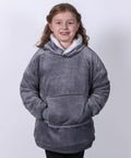 A young girl smiling, wearing a grey plush hooded Ribbon RI003 sweatshirt with her hands in the front pocket.