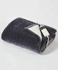 A folded Ribbon electric blanket, model RI012, in gray with a white lining and an attached remote control, is displayed on a plain white background.