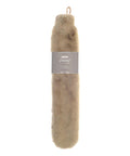 A beige, faux fur Hot Water Bottles & Covers with a loop handle and a grey label around the middle displaying product information.
