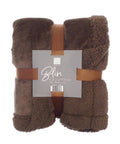 A folded brown luxury throw blanket with a plush, fuzzy texture is secured by two tan straps. A grey centre label reads "Blankets" and shows the size 150 x 200 cm.