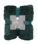 A dark green folded luxury blanket with a soft, plush texture is tied with matching ribbon. The label says "Blankets" and lists the size as 150 x 200 cm.