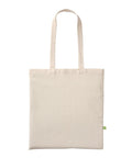 A plain off-white canvas tote from Bags with two long handles and a small green label on the right side, displayed against a white background.