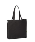 A plain black fabric tote bag from Bags with two long shoulder straps, standing upright against a white background.