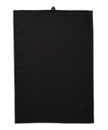 A plain, rectangular black Towels tea towel is laid flat on a white background, featuring a small loop for hanging at the centre of the top edge.