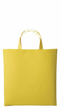 A plain yellow Nutshell RL110 tote bag with handles against a white background. The bag features a simple, rectangular shape and appears to be made of fabric.