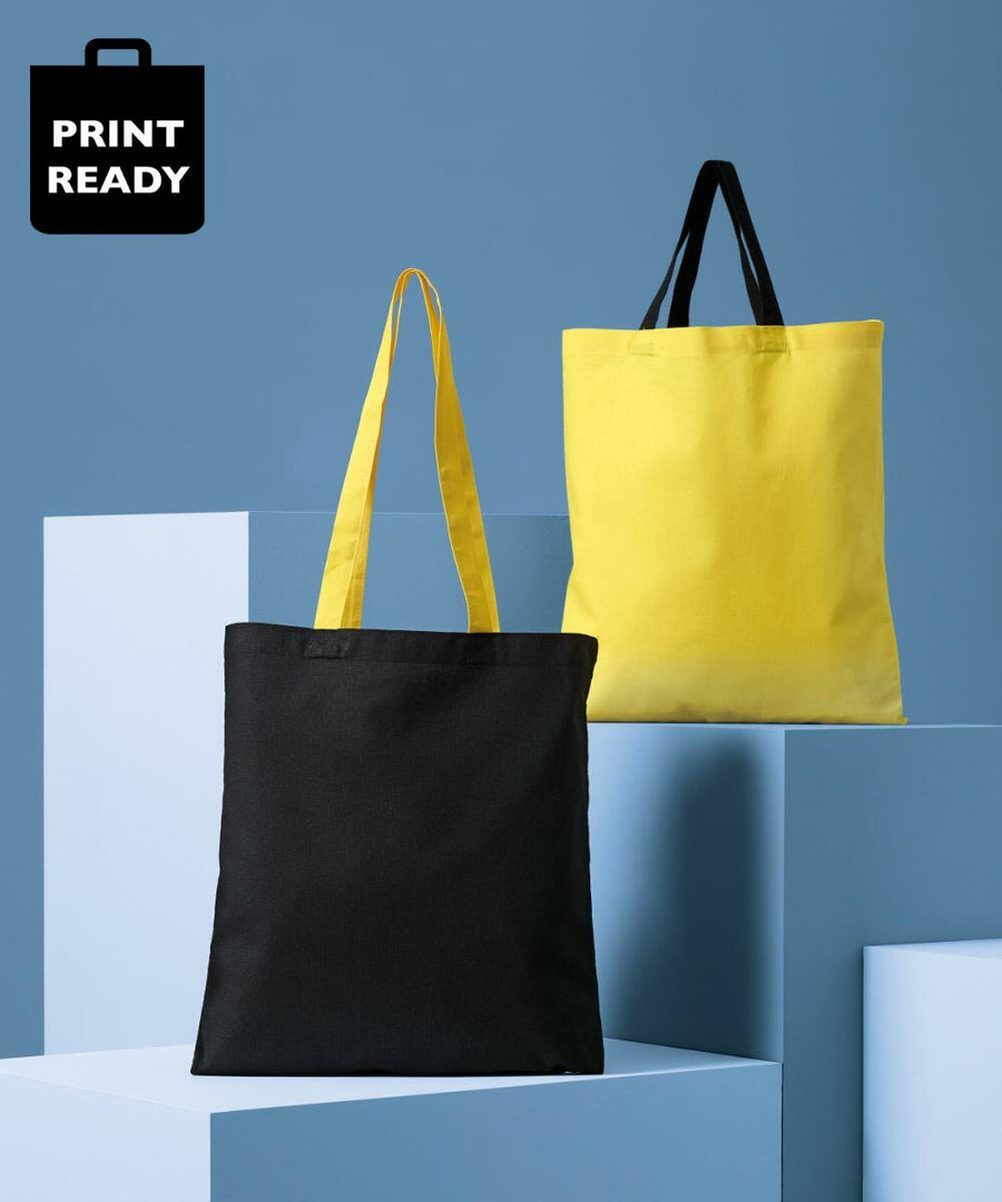 Two Nutshell RL130 tote bags displayed on geometric platforms against a blue background. The front bag is black with yellow handles, and the back bag is yellow with black handles. A "PRINT READY" label is at the top left.