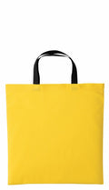 A vibrant yellow RL130 tote bag by Nutshell, featuring black handles and a sleek, rectangular design, is displayed against a white background.