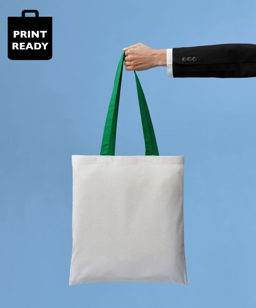 A person in a black suit holds a Nutshell RL150 with green handles against a blue background.