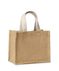 A rectangular, tan jute tote bag named "Bags" with sturdy white handles stands upright on a white background. The spacious bag has a simple, unembellished design and appears empty.