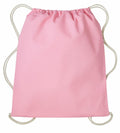 A Nutshell RL300 pink drawstring backpack with beige cords is centered against a white background. The bag features a simple, minimalist design with a smooth fabric texture.