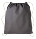 The RL300 by Nutshell, a gray drawstring backpack featuring white cords, is displayed against a plain backdrop. The top is cinched to reveal its closure mechanism, and the fabric exhibits a smooth yet slightly textured appearance.