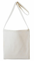 The RL400, a canvas tote bag from Nutshell, features a minimalist design and a long strap. It is pictured empty against a white background, highlighting its simplicity.