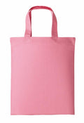 A Nutshell RL500 fabric tote bag in plain pink, featuring two handles and a simple, unadorned design, lying flat against a white background.