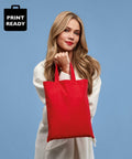 A person with long hair in a white coat holds a red tote bag against a blue background. The text "Nutshell RL500" is displayed in the top left corner.