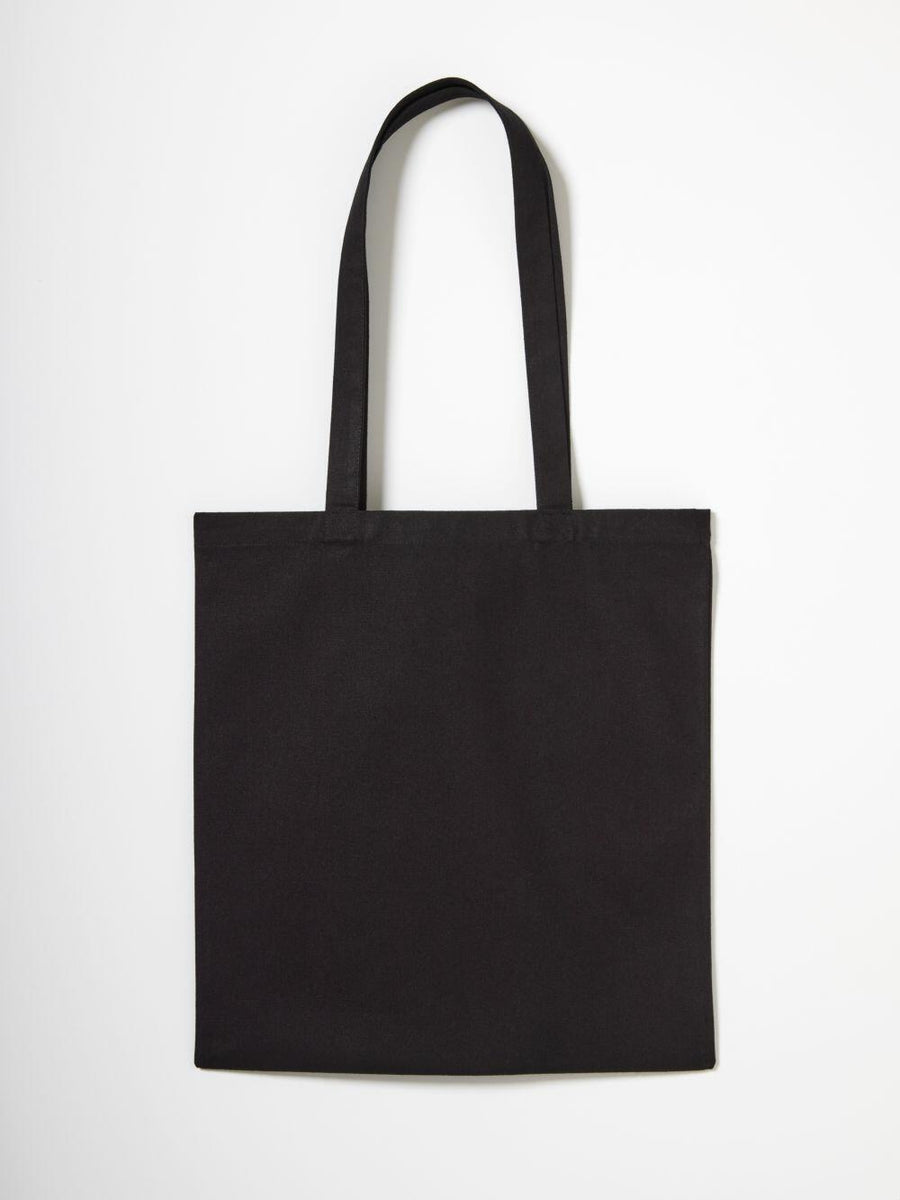 A Nutshell RL650 plain black tote bag with long handles set against a white background.