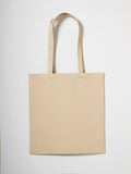 A Nutshell brand RL650 plain beige tote bag with long handles set against a white background.