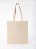 The RL670 by Nutshell, a plain beige tote bag with long handles, is set against a white background.