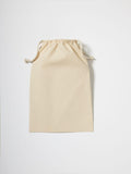 A Nutshell RL700 drawstring pouch in beige on a white background.
