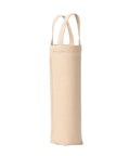 A narrow beige fabric tote bag from Bags with two handles stands upright on a white background, appearing empty.