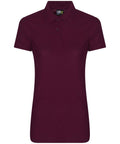 The RX05F by ProRTX is a maroon polo shirt featuring short sleeves, a collar, and three buttons.