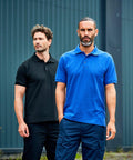 Two men standing outdoors; one wearing a black ProRTX RX110 polo shirt and the other wearing a blue ProRTX RX110 polo shirt.