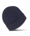 A beanie hat in dark blue knit with a folded brim is displayed at an angle against a white background, casting a faint shadow below.