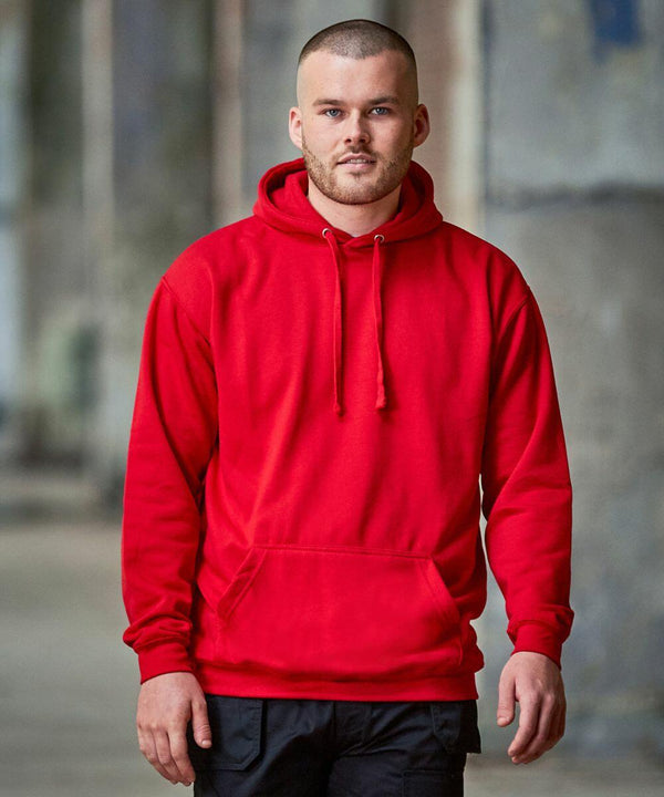 A man with a short haircut wearing a red ProRTX RX350 hoodie and black pants poses for a photo in an urban setting.