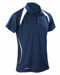 The S177M by Spiro is a navy blue polo shirt with short sleeves, adorned with white accents on the shoulders and sides. It includes a two-button placket and a small logo near the bottom hem.
