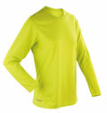 A vivid yellow-green athletic shirt from Spiro, featuring long sleeves and a round neckline, set against a white background.