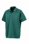Spiro's S288X short-sleeve polo shirt in green, featuring a collar and three buttons, is showcased on a white background.