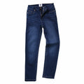 A pair of SD011 jeans by AWDis So Denim in dark blue denim, displayed flat with a partially open zipper and button.