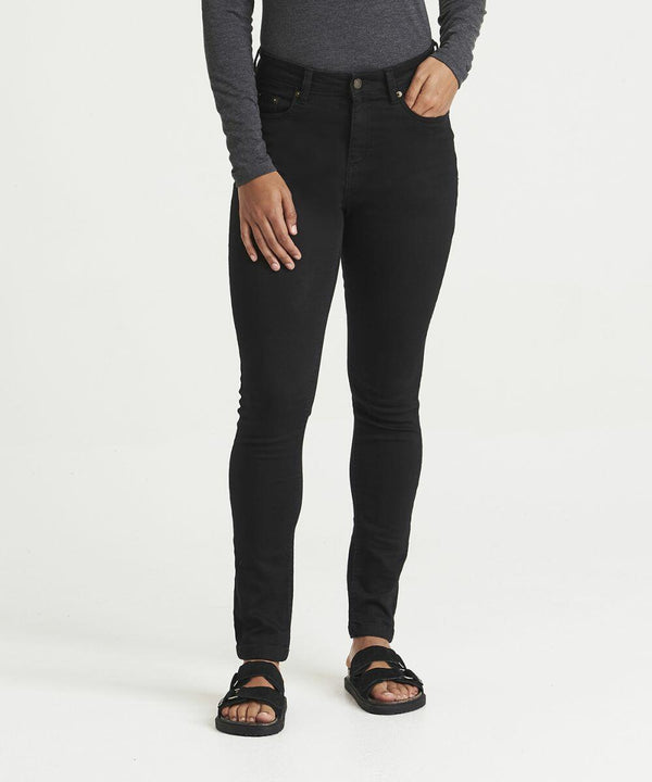 Person wearing a long-sleeve dark gray AWDis So Denim SD014 shirt, black skinny jeans, and black sandals, standing against a plain white background.