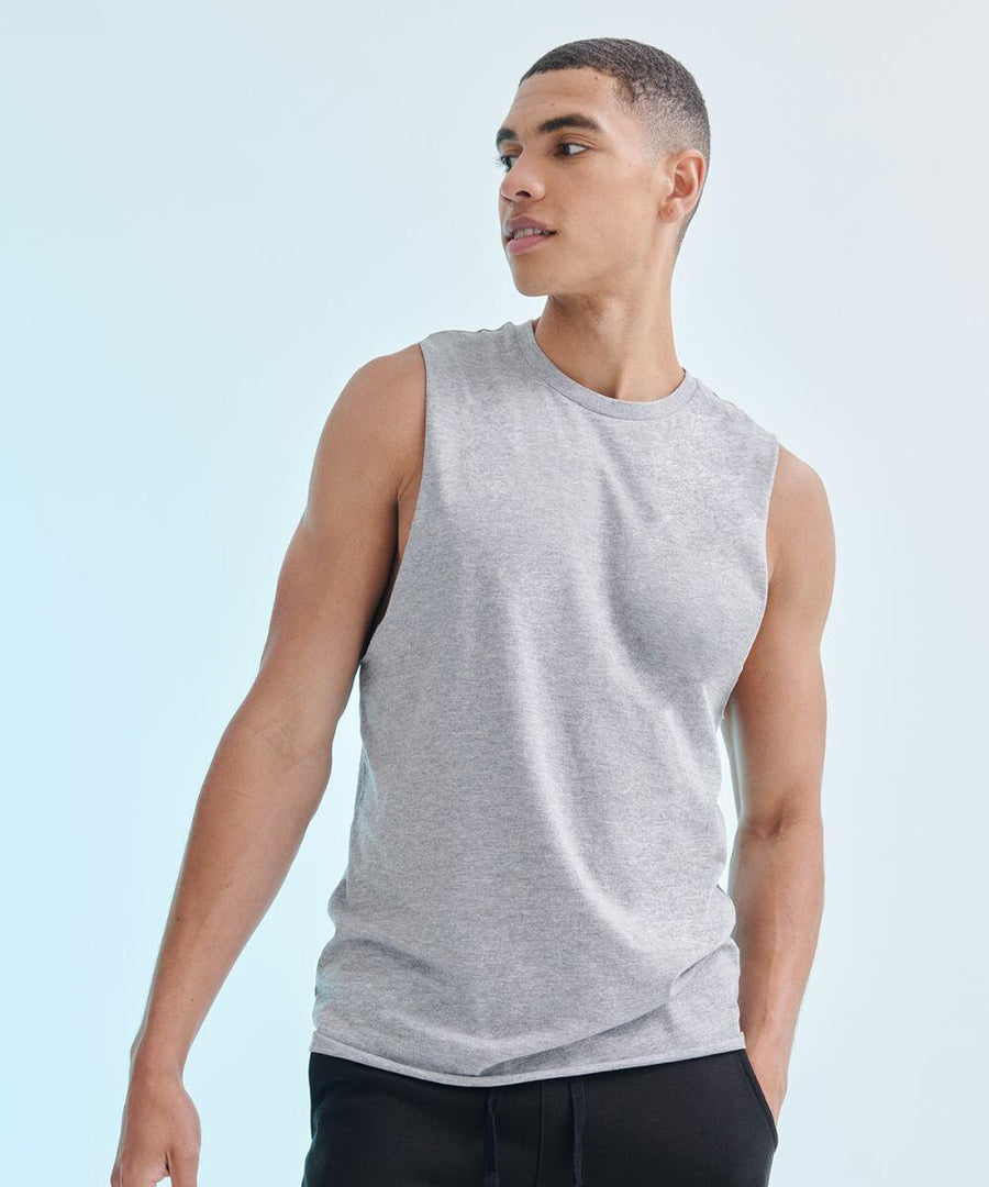 A person wearing an SF SF232 gray sleeveless shirt and black pants looks to the side against a light blue background.