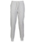 Skinnifit SF425 sweatpants in gray, designed with an elastic waistband and a drawstring, along with cuffed ankles.