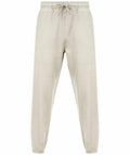 Skinnifit's SF430 beige sweatpants come with an elastic waistband and drawstring, complemented by ribbed cuffs. They are showcased against a plain white background.